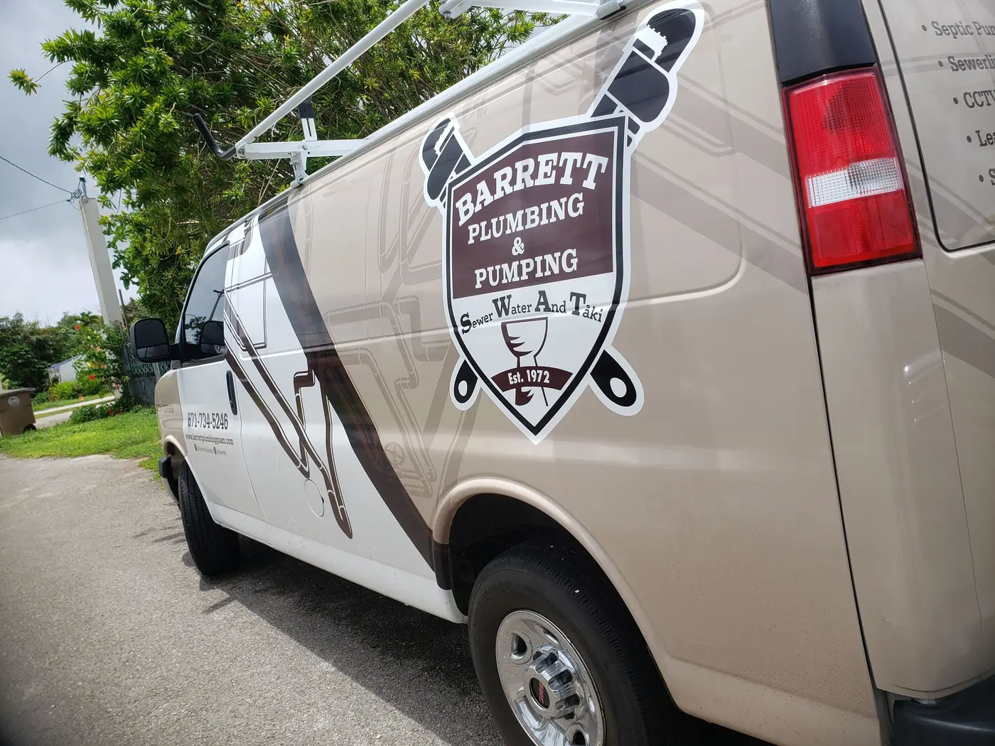 A Barrett van with the Barrett Plumbing & Pumping badge on its side