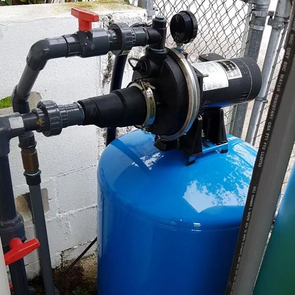 Booster water pump on a blue pressure tank, installed by Barrett